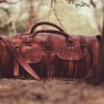 leather holdall in the forest during autumn