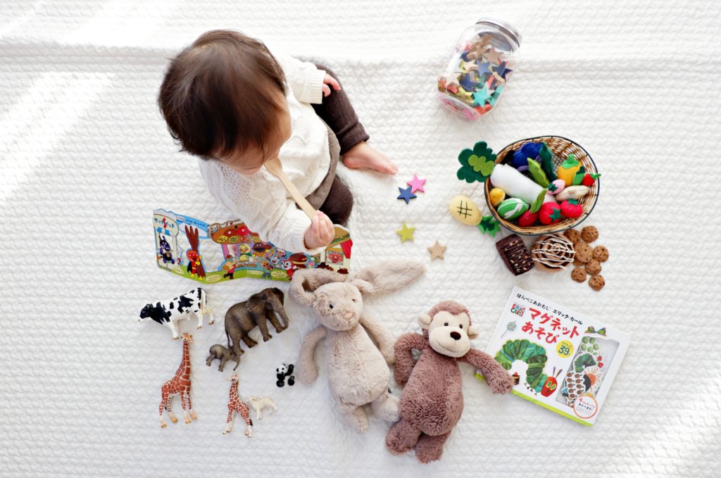 baby on playmat with toys